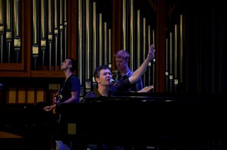 Jordan Pratt (left), senior psychology major, and Ben Wilson (right), senior chemistry major, lead worship along with Travis Cottrell, worship pastor at Englewood Baptist Church.