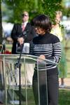 Melanie Taylor, junior sports management major, gives a dedicatory reading during the groundbreaking ceremony for the new library. - Photo by Jacob Moore