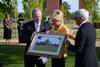 David S. Dockery, president of the university, presents a framed rendering of the new Union library to Bill and Carol Latimer as part of the groundbreaking ceremony. The Bill and Carol Latimer Foundation provided a $10 million lead gift for the new library project. - Photo by Jacob Moore