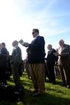 Hunter Baker (center), associate professor of political science, and other guests sing 'Great is Thy Faithfulness' during the groundbreaking ceremony for the new library. - Photo by Anne Richoux