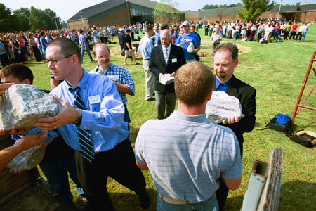 Union employees Ronnie Smith, Charlie Agnew, Richard Joiner and Michael Mallard participate in the removing of the stones from the altar of the September 11 Memorial Environmental Installation.