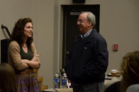 Kylie McDonald, junior political science major, talks with David S. Dockery, president of the university, prior to a Student Senate meeting.