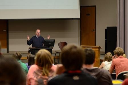David S. Dockery, president of the university, talks to students about upcoming plans for the university during a Student Senate meeting.