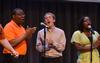 David Madden, freshman digital media studies major, Zac McMillan, sophomore intercultural studies major, and Treasure Hightower, senior digital media studies major, sing in chapel with MOSAIC choir. - Photo by Jacob Moore