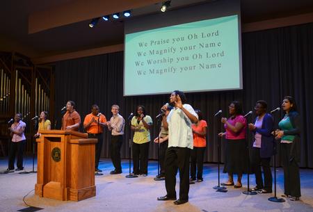 MOSAIC choir leads chapel attendees in upbeat songs.