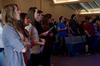 Students sing hymns prior to G.O. trip reports in chapel.  - Photo by Anne Richoux