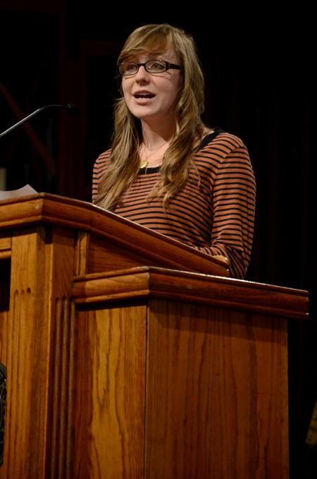 Cari Phillips, senior public relations major, speaks in chapel about her G.O. trip to Memphis. 