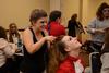 Rachel West, freshman nursing major, helps style hair for Taylor Klock, freshman English major, for Zeta Tau Alpha's performance at the 15th annual Variety Show. - Photo by Jacob Moore