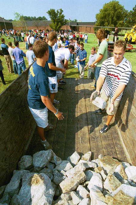 A number of students participated in an assembly line formed to finish the removal of the stone altar during the September 11 Service of Remembrance and Response.  (right - Sophomore Chadd Hodges, Christian studies major)