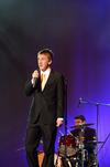 Zac McMillan, sophomore intercultural studies major, sings at the 15th Annual Variety Show, which was hosted by SAC, while the judges finalize their votes. - Photo by Zac Calvert