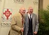 Terry Bradshaw, keynote speaker, poses with Steve Beverly, associate professor of communication arts, after the fourth annual Roy L. White Legacy Golf & Gala. - Photo by Jacob Moore