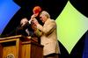 David S. Dockery, president of the university, presents keynote speaker, Terry Bradshaw, former NFL quarterback and current FOX Sports analyst with a Union baseball cap at the fourth annual Roy L. White Legacy Golf and Gala.  - Photo by Ebbie Davis