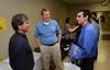 Aaron Porterfield, senior engineering major, talks with Roger Smith, senior programmer of Logical Systems Inc., and Ryan Eller, improvement facilitator for Gerdau Ameristeel, during an engineering and technology expo in the PAC hallway. - Photo by Jacob Moore