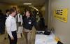 Ky Bailey, junior engineering major, talks with Roger Smith, senior programmer for Logical Systems Inc, during an engineering and technology expo. - Photo by Jacob Moore