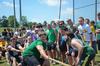 The men of Lambda Chi Alpha cheer on their fellow members as they participate in the rope pull during Greek Olympics. - Photo by Zac Calvert
