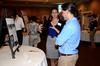 Holly Jay, junior sociology and intercultural studies double major, talks to Fonsie Guilaran, associate professor of physics, about her research during the poster presentations of the Scholarship Symposium. - Photo by Anne Richoux