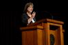Mary Ann Poe, professor of social work and BSW program director, uses a pedometer as an illustration as she speaks about the importance of following in the steps of Jesus.  - Photo by Anne Richoux