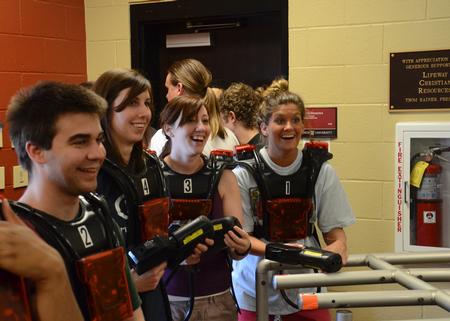 Kenan Keller, Laura Axelson, Mikayla Wagner and Jessica Frizzell get excited while listening to laser tag instructions during May Day, hosted by SAC.