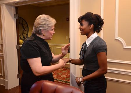 Lanese Dockery, first lady of the university, talks with Melanie Taylor, junior sports management major, during the 2012 Etiquette Dinner.