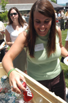 Senior class president Laurie Skinkle grabs her beverage of choice at the graduation luncheon. - Photo by Jonathan Blair