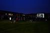 Students gather to watch Sherlock Holmes 2 for SAC's Movie on the Lawn. - Photo by Anne Richoux