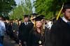 Andi Schreiber, family studies graduate, smiles at some of her friends during the beginning processional of spring graduation. 
 - Photo by Zac Calvert