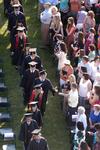 Graduates greet their friends and family as they file into spring graduation on the Great Lawn. - Photo by Kristi McMurry