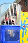 Jon Abernathy, director of the office of disability services, gets dunked at Residence Life's stress-free zone during finals week.  - Photo by Anne Richoux