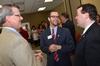 Norman Hill, chair of the university board of trustees, Landon Preston, director of donor relations, and Josh Clarke, director of alumni relations, chat together preceding the dedication ceremony of the new Hendersonville facility. - Photo by Morris Abernathy