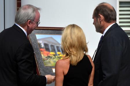 David S. Dockery, president of the university, presents Jim and Janet Ayers, major donors to the project, with a gift during the dedication of the new Hendersonville facility.