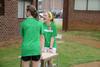 Kendall Heyliger, sophomore nursing major, helps carry a desk through the rain during new student move-in day. - Photo by Jacob Moore