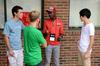 Upperclassmen students mingle with some incoming freshmen during new student move-in day. - Photo by Anne Richoux