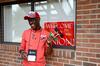 Jeremy Murila, freshman engineering major from Nairobi, Kenya, waves his country's flag after traveling over 8,200 miles to move into his room at Union on new student move-in day.  - Photo by Ebbie Davis