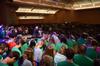 David S. Dockery, president of the university, leads a prayer blessing the incoming class. New students are seated in the middle of the room, with their families, faculty, staff and upperclassmen surrounding them. - Photo by Jacob Moore