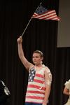 Focus leader Wil Story portrays a flagpole in one of the skits performed for the incoming freshmen and transfer students at the Focus Show. - Photo by Jacob Moore