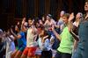Focus leaders perform hand choreography to "Butterfly Kisses" for the incoming freshmen class and transfer students at the Focus Show. - Photo by Jacob Moore