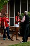 David S. Dockery, president of the university, welcomes Holly Johnson, freshman business major, and other new students to his home for the annual ice cream social.  - Photo by Anne Richoux