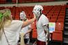 Kristen Reed (middle), junior nursing major, laughs as Abbie Duke (left), freshman biology major, pies Kevin Morgan, sophomore psychology major, in the face during the LifeGroup fair.  - Photo by Anne Richoux