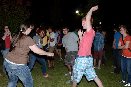 Freshmen, Emily Pace, engineering major, Ashley Akerson, missions and art double major, Nick Rivera, pre-med biology major, and Ben Baytes, music major, play Ninja together during the Howdy Party.  