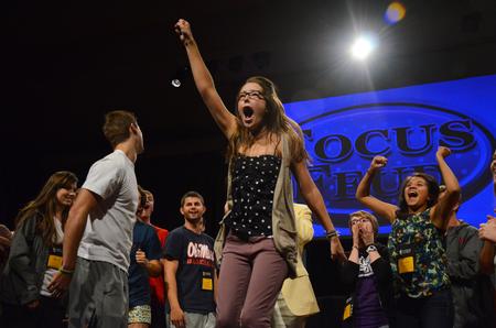 Shea Wingate, junior political science major, celebrates after winning a paper-rock-scissors tournament during the annual SAC game show.