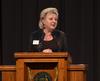 Sheila Mitchell, dean of the school of pharmacy, welcomes family and friends to the White Coat Ceremony for the pharmacy class of 2016. - Photo by Morris Abernathy