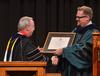 David S. Dockery, president of the university, installs Hunter Baker as the Dean of Instruction during Fall Convocation. - Photo by Morris Abernathy
