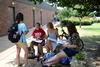 Emily Knight (left), sophomore biology major, Emily Georgoulis, sophomore math major, Naomi Pietenpol, freshman math major, and Brittany Hagler, sophomore chemistry major, study statistics outside on a beautiful day.  - Photo by Ebbie Davis
