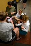 Chesea Coudriet and Morgan Kroeger chat and laugh with Taylor Brown and Rebecca Leon during residence life's Ladies Night in the Bowld Student Commons.   - Photo by Anne Richoux
