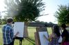 Peter Riggs and Elizabeth Oakes draw the negative space of the trees, during an outdoor drawing class.  - Photo by Ebbie Davis