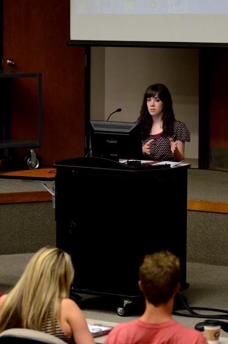 Sophomore Jenaye White answers questions about a proposed resolution during Student Senate. 
