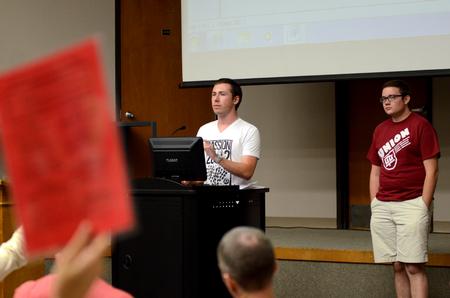 Jordan Wilson, senior accounting major, counts votes on a bill proposed during Student Senate. 