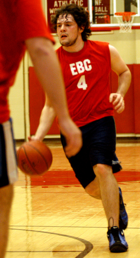 Sophomore Wes Calvert drives down the court during an intramural basketball game.