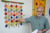 David Burke, professor of theatre and director of the theatre, discusses  his art exhibit, being featured at the Ned in downtown Jackson.  - Photo by Ebbie Davis