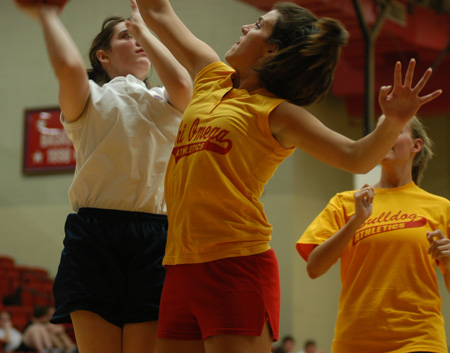 Independent Tina Smith shoots over Chi Omega Kerra Kunce during an intramural basketball game.